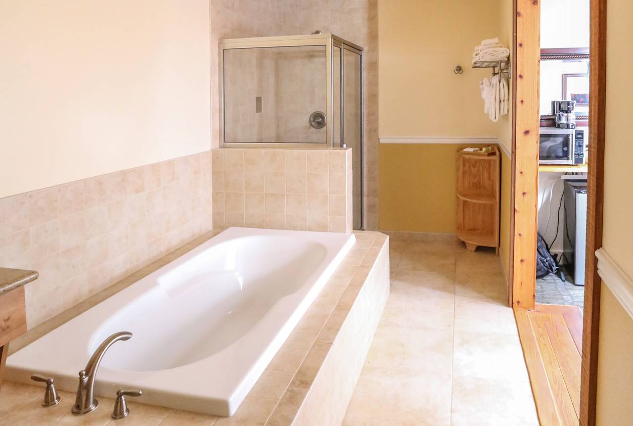 The Kalaloch Suite features a spacious bathroom with two-person tub and separate shower.