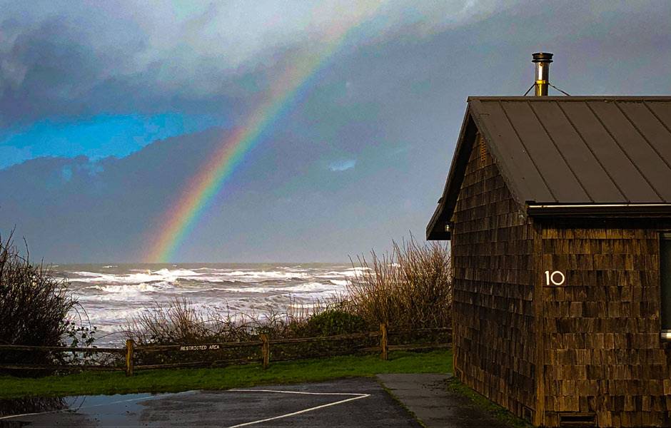 A rainbow next to the cabins at Kalaloch Lodge