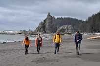 A group of hikers at Ruby Beach in Olympic National Park