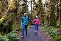 Two Olympic National Park visitors exploring a trail in the Hoh Rainforest