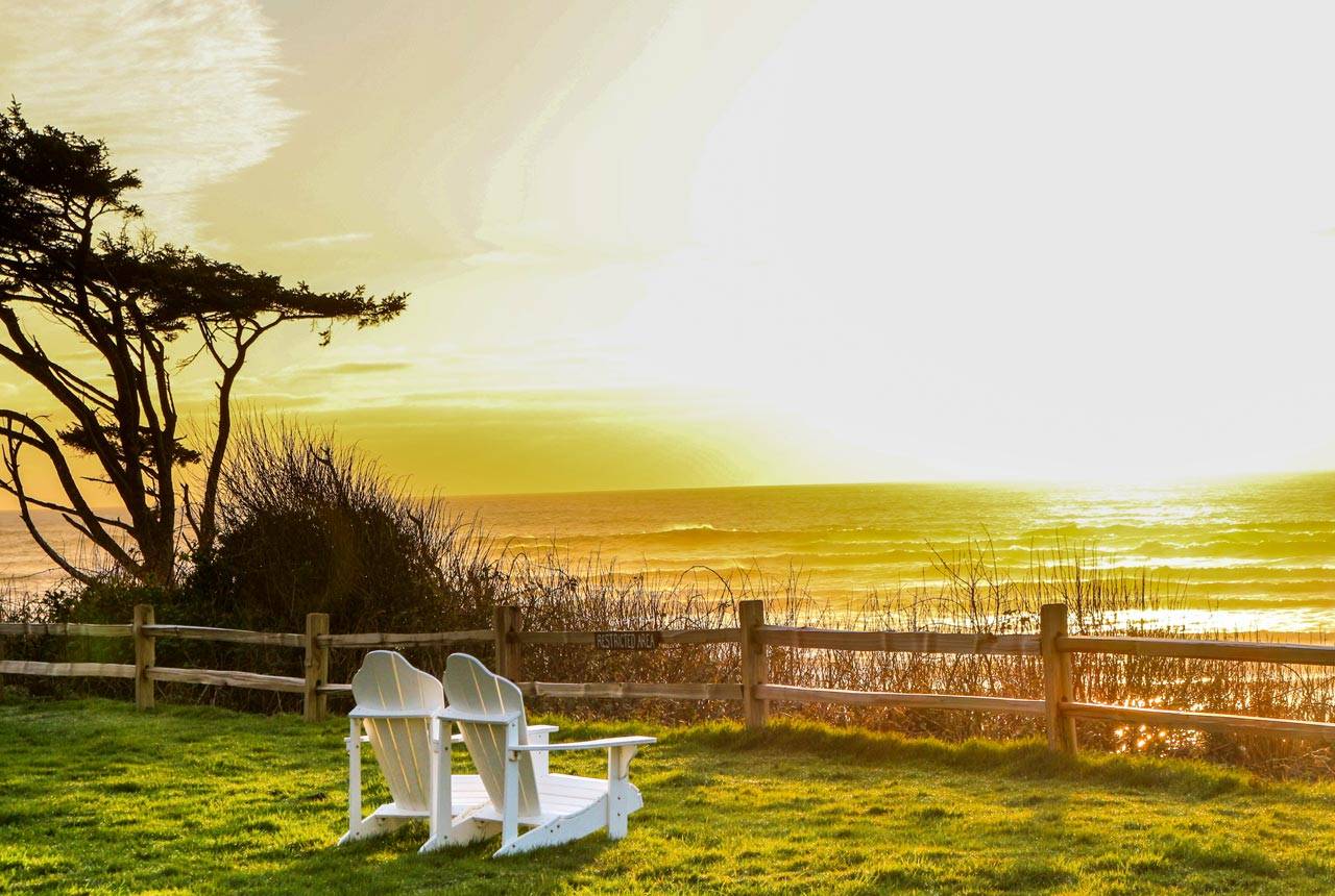Two chairs sit overlooking sunset along Kalaloch Beach in Olympic National Park
