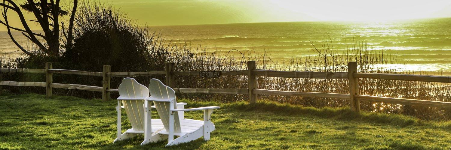 Two chairs sit overlooking sunset along Kalaloch Beach in Olympic National Park