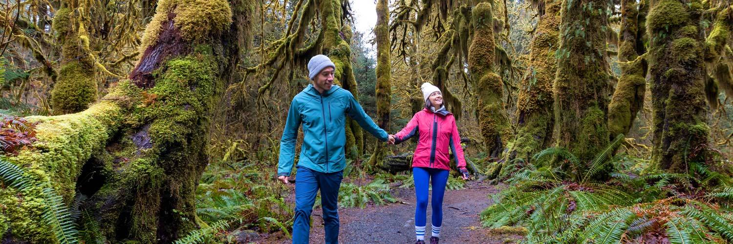 A couple hiking in the Hoh Rainforest in Olympic National Park