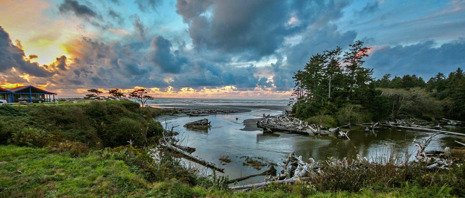 View from Kalaloch Lodge including Kalaloch Creek flowing out into the ocean at sunset