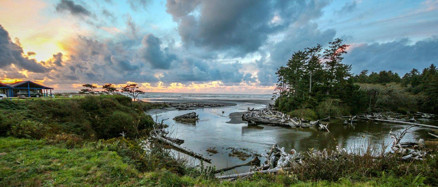View from Kalaloch Lodge including Kalaloch Creek flowing out into the ocean at sunset