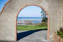An inviting arch at Kalaloch Lodge frames a view of the ocean beyond.