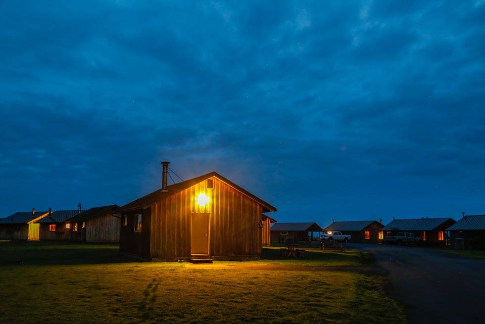 Warm and cozy cabins welcome visitors to Kalaloch Lodge in the evening glow.